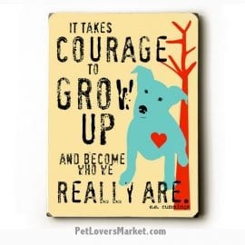 It takes courage to grow up. Wooden signs with quotes.